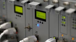 Front panel of industrial computer system with I/O ethernet connectors and cables. Selective focus on primary CPU module. Front panel of industrial computer system with I/O ethernet connectors and cables. Selective focus on primary CPU module.