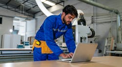 engineers and technician using laptop checking and repair pressing metal machine at factory, Machine maintenance technician operation concept. engineers and technician using laptop checking and repair pressing metal machine at factory, Machine maintenance technician operation concept.