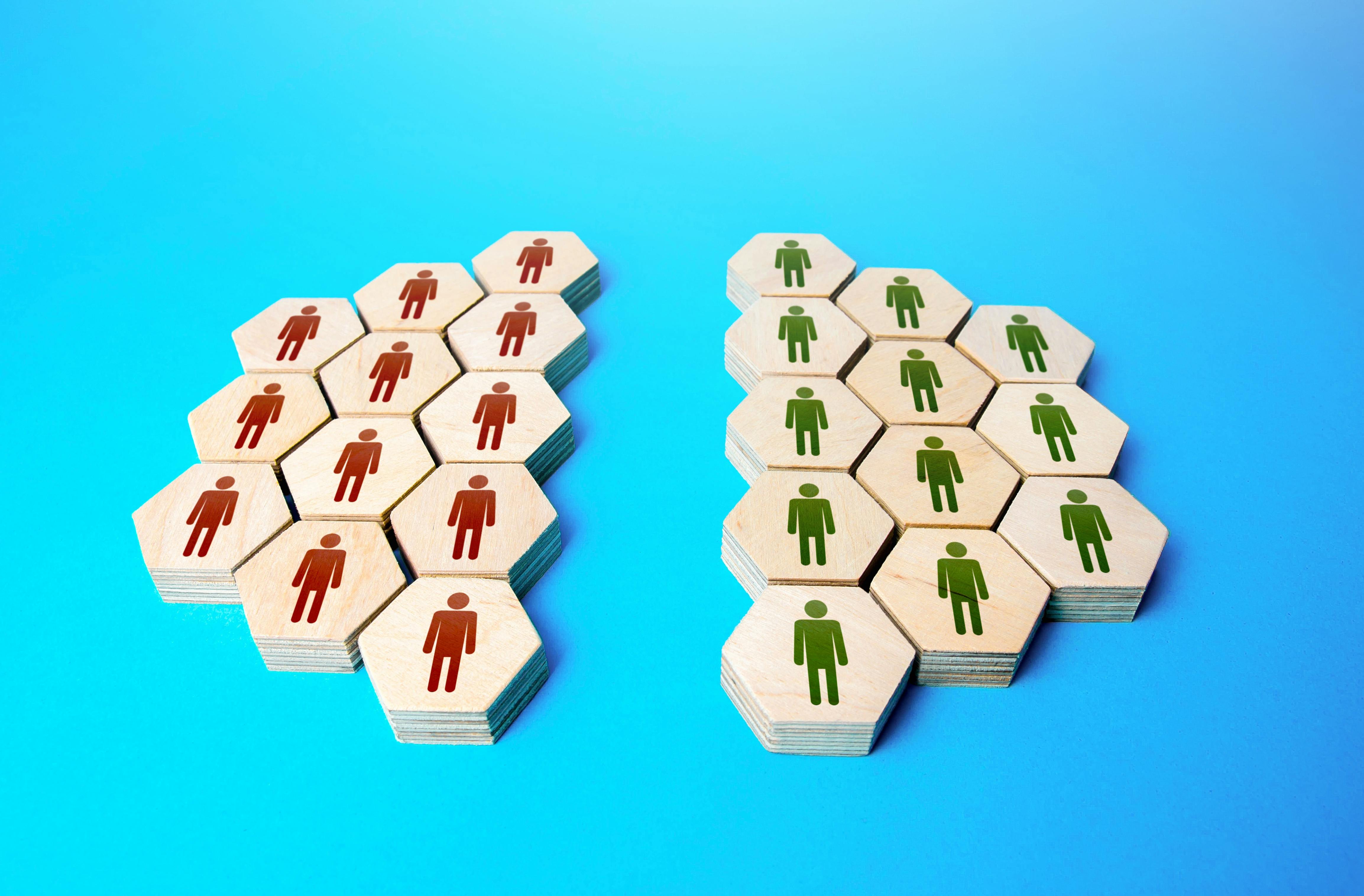 The group of people is divided equally on the issue. Two camps of thought. Integrity violation. Opinion differences. Merging into a organization. Association breakup. Reconciliation. Community split.