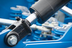 Black piston or actuator as part of blue pneumatic or hydraulic machine. Technology and engineering Black piston or actuator as part of blue pneumatic or hydraulic machine. Technology and engineering