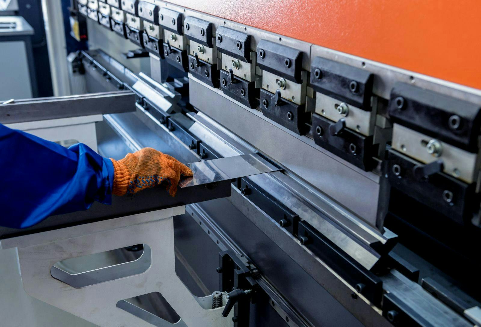 The technician operator uses hydraulic bending machine.