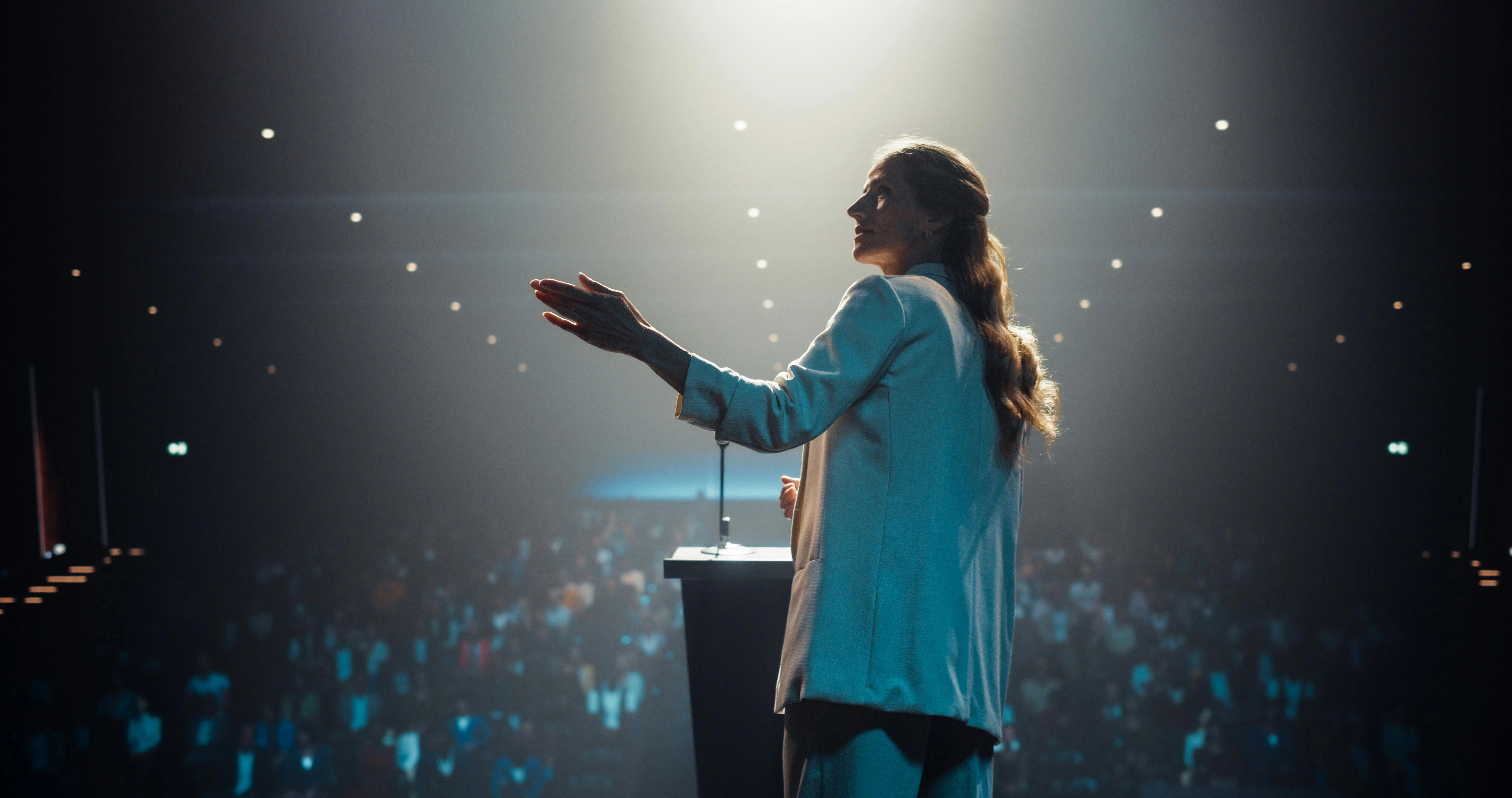 Personal Growth Keynote Speaker Delivering a Motivational Speech on Stage