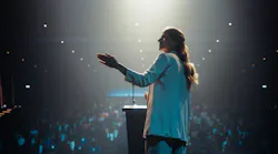 Personal Growth Keynote Speaker Delivering a Motivational Speech on Stage