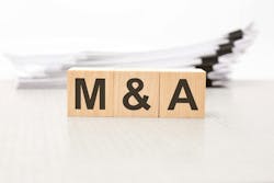 text m and a - Mergers and Acquisitions - on wooden blocks. the background is a business papers. finance concept. white background text m and a - Mergers and Acquisitions - on wooden blocks. the background is a business papers. finance concept. white background