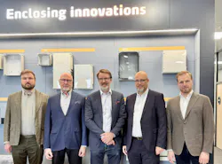 Fibox executive team poses together in the company's office Fibox executive team poses together in the company's office