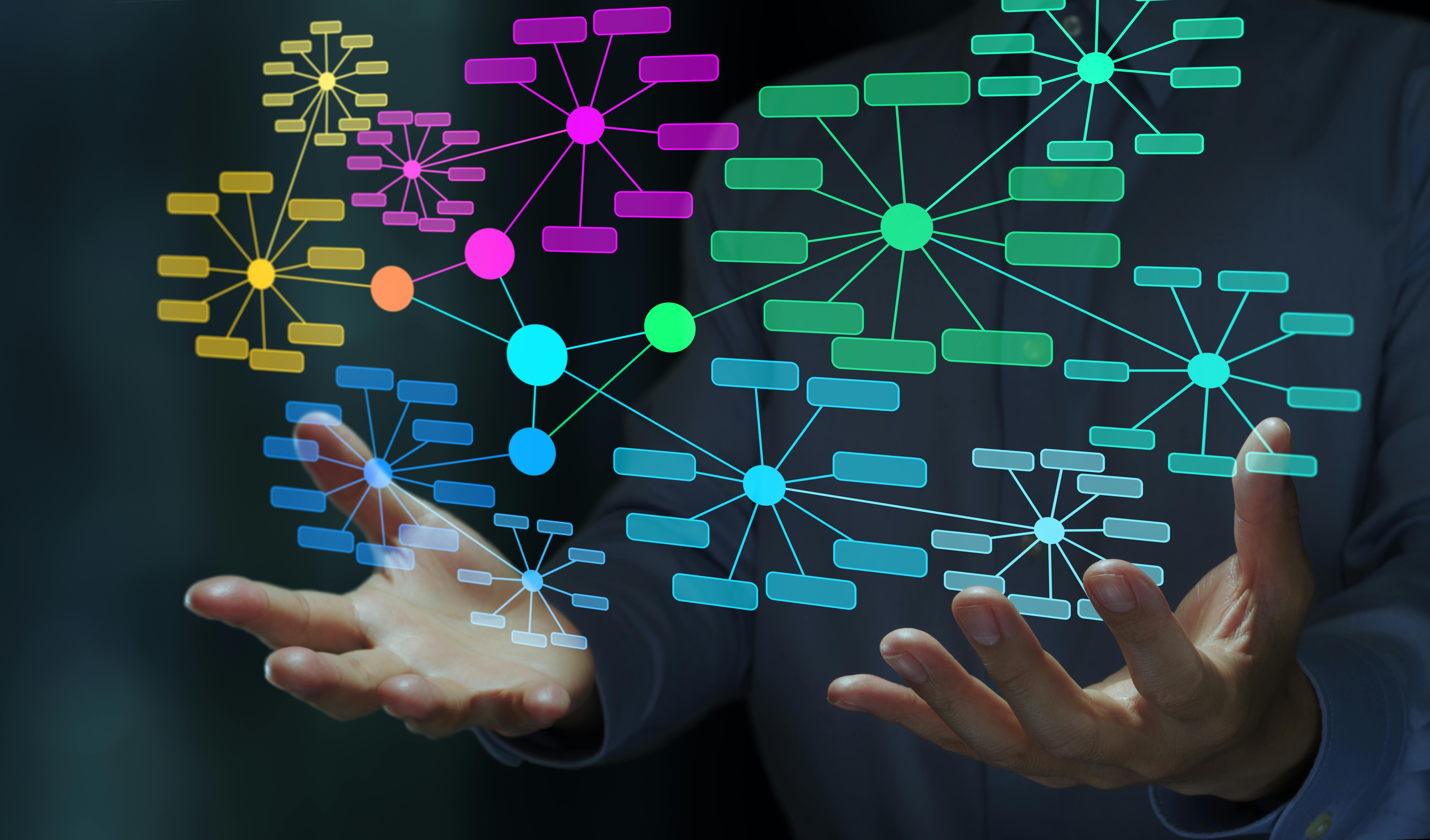 Businessperson holding a knowledge graph.