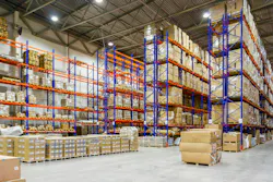Interior of a modern warehouse storage of retail shop with pallet truck near shelves Interior of a modern warehouse storage of retail shop with pallet truck near shelves