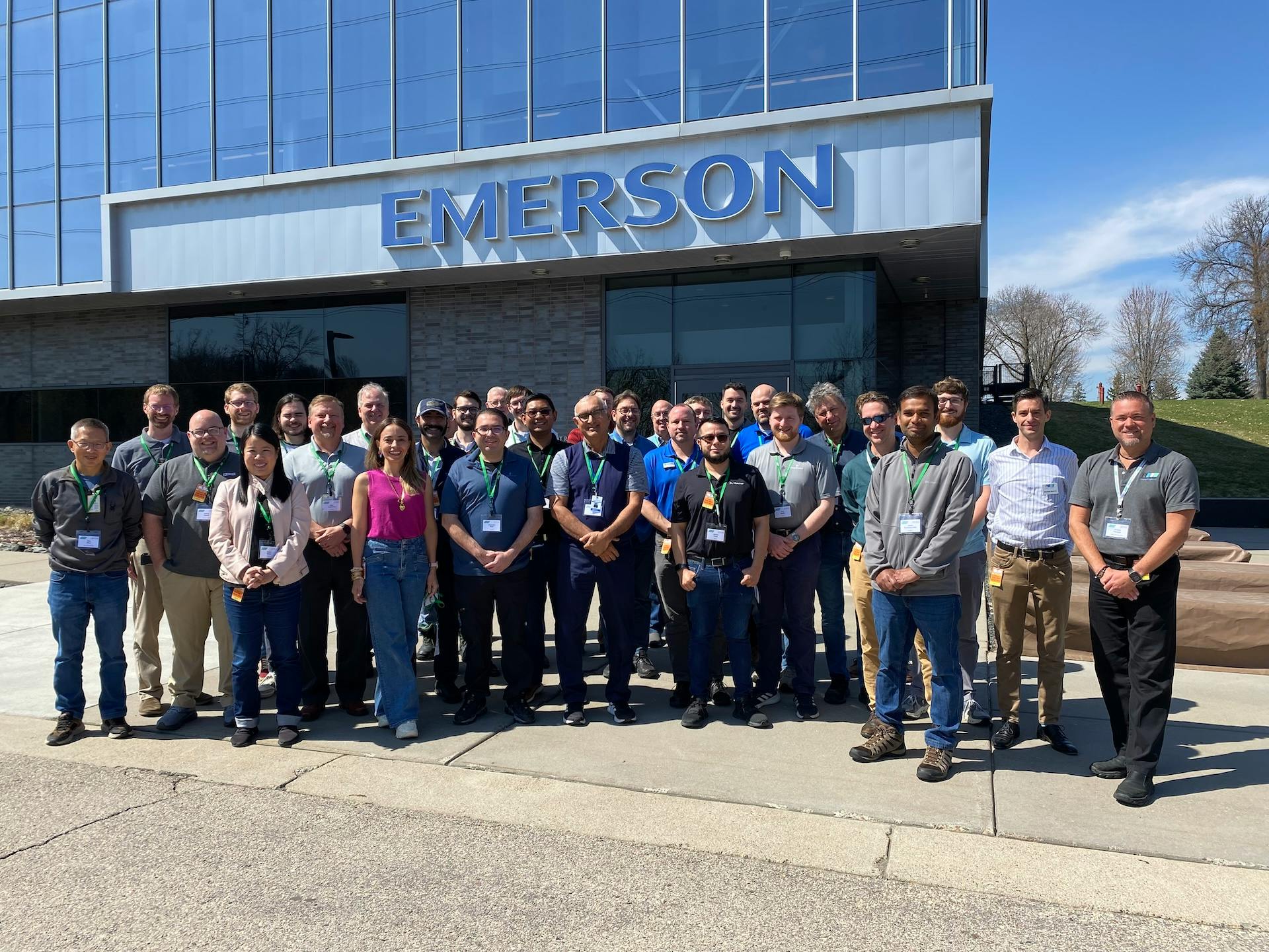 Industry officials posing outside Emerson's facility at North American Profinet Plugfest