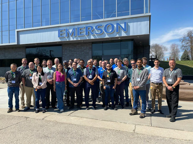 Industry officials posing outside Emerson's facility at North American Profinet Plugfest