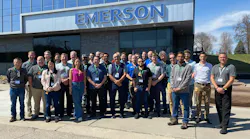 Industry officials posing outside Emerson's facility at North American Profinet Plugfest