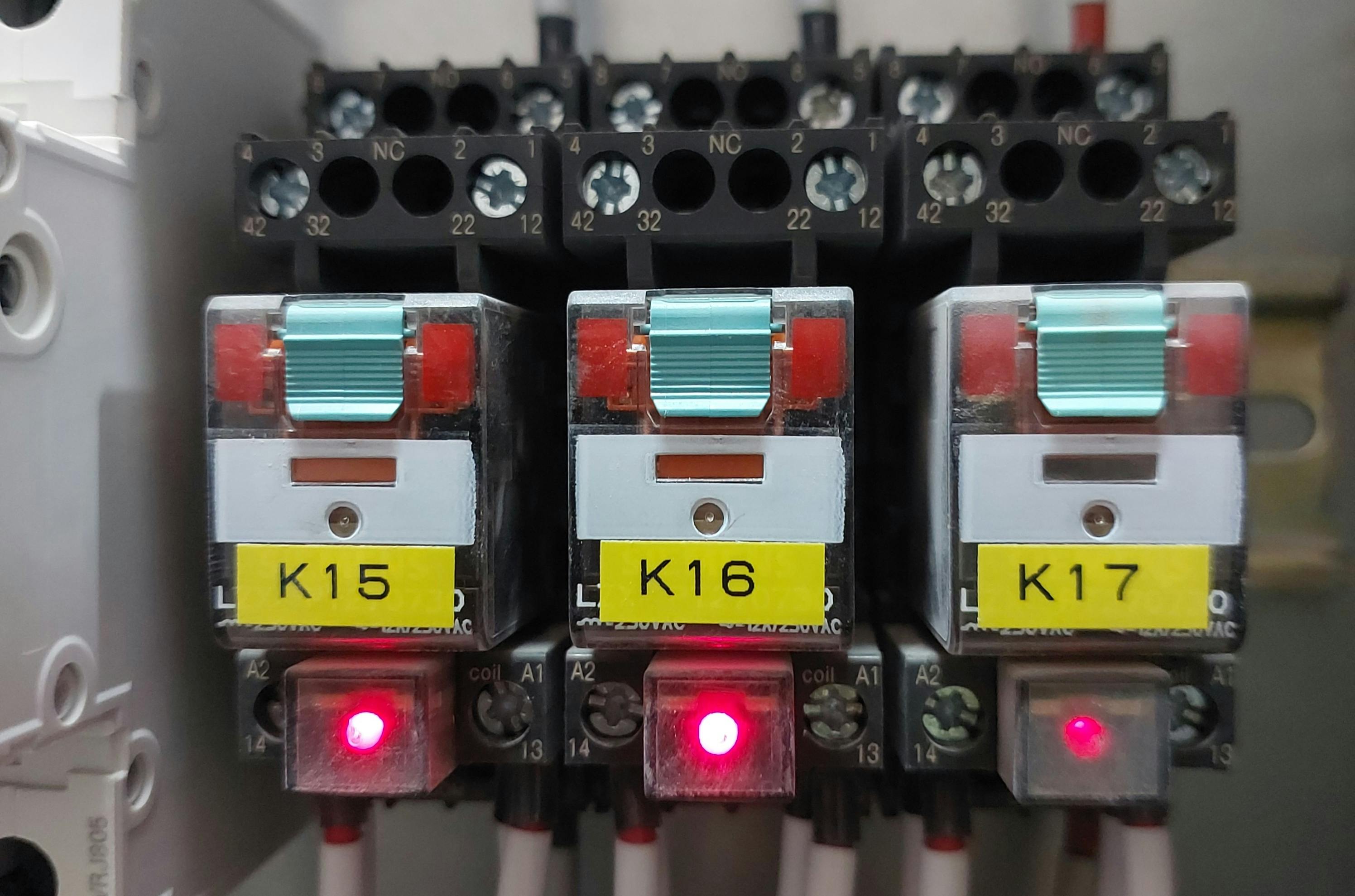 An electrical relay bank inside an industrial control panel.