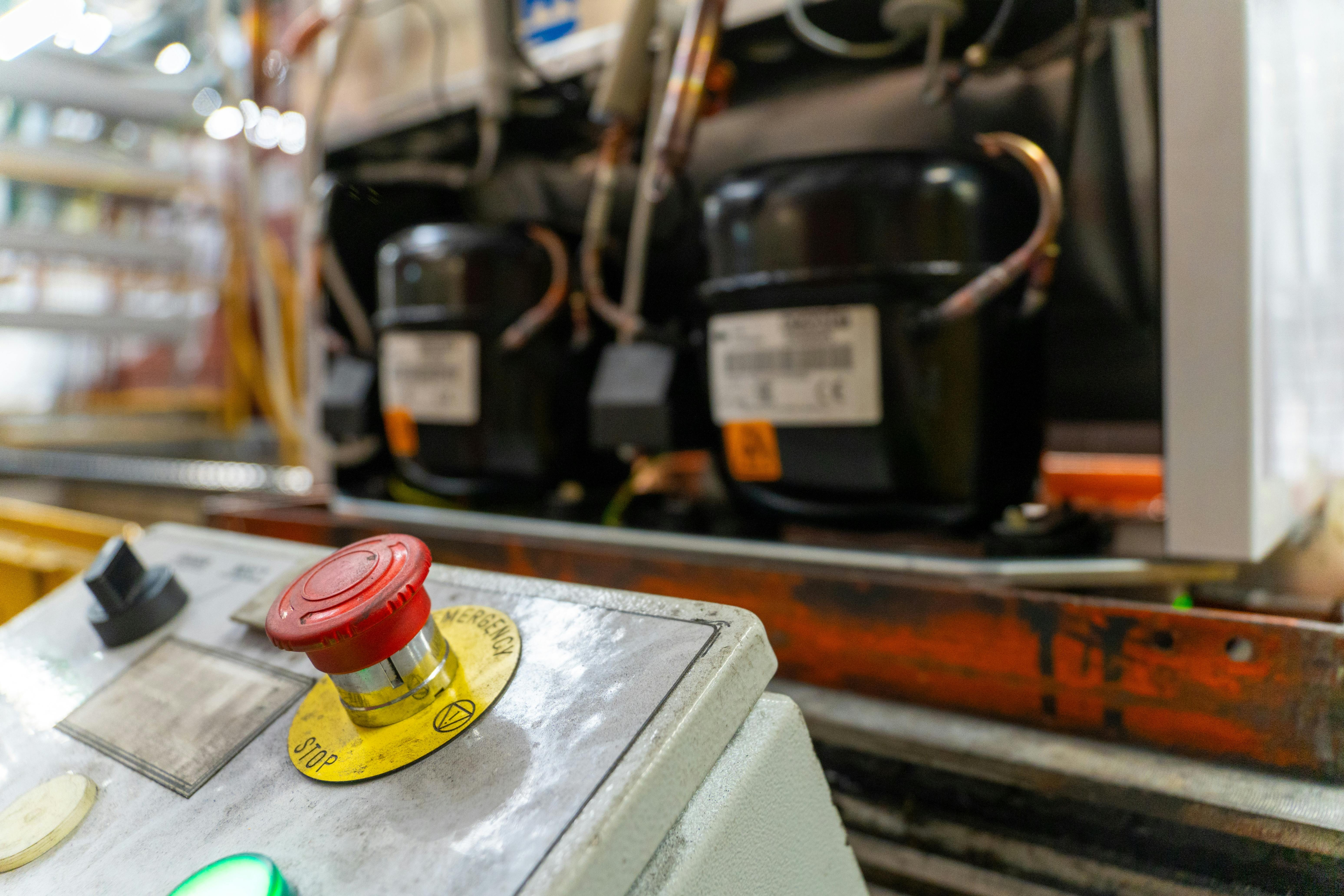Emergency Stop installed at line conveyor in refrigerator manufacturing plant.