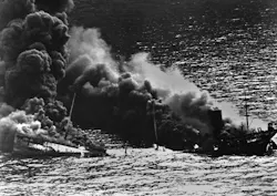 Allied tanker torpedoed in Atlantic Ocean by German submarine during World War 2. The ship crumbled amidships under heat of fire as she settled toward bottom of sea. 1942. Allied tanker torpedoed in Atlantic Ocean by German submarine during World War 2. The ship crumbled amidships under heat of fire as she settled toward bottom of sea. 1942.