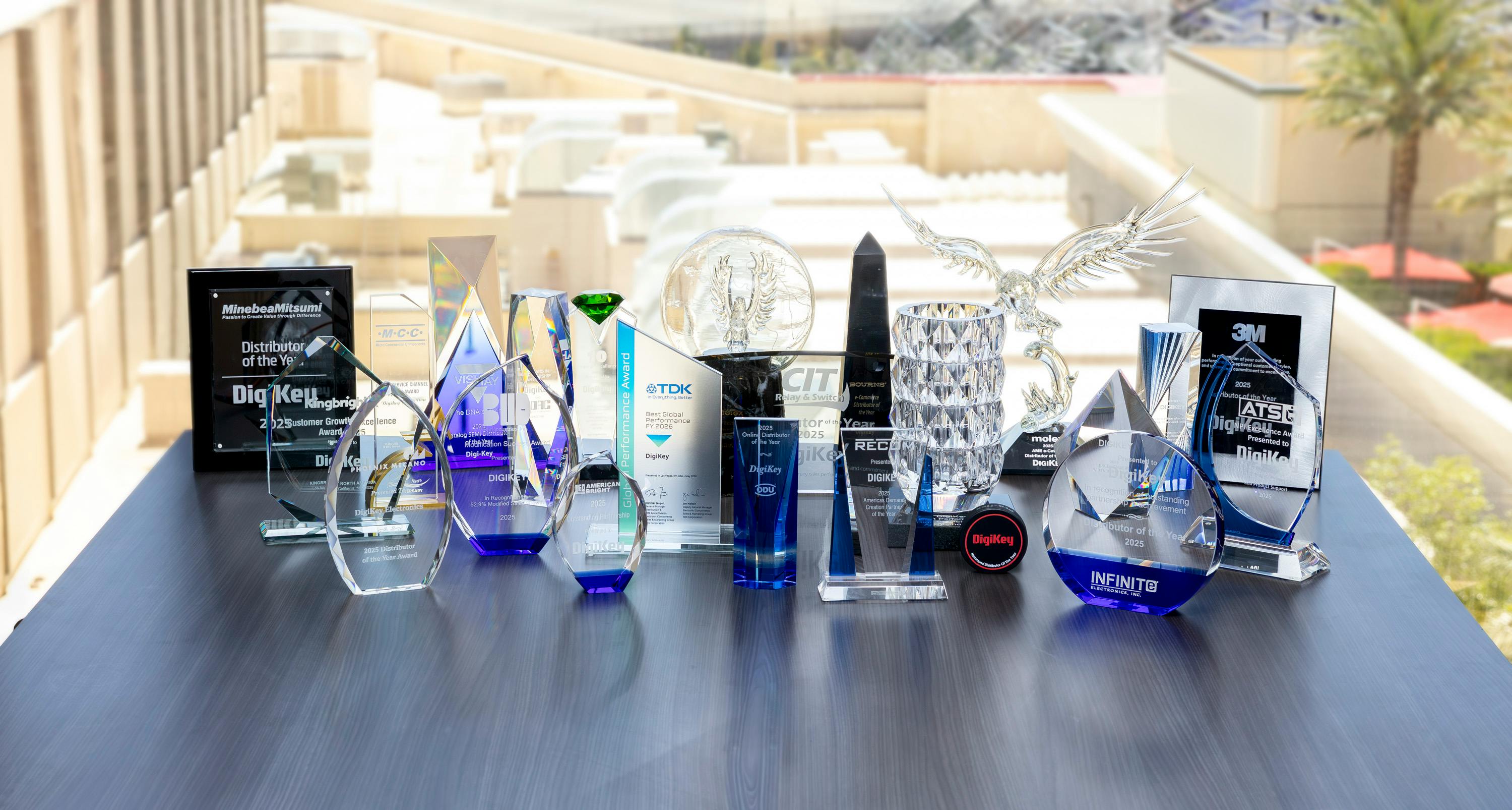 DigiKey's awards from its 2026 EDS Leadership Summit displayed on a wooden table