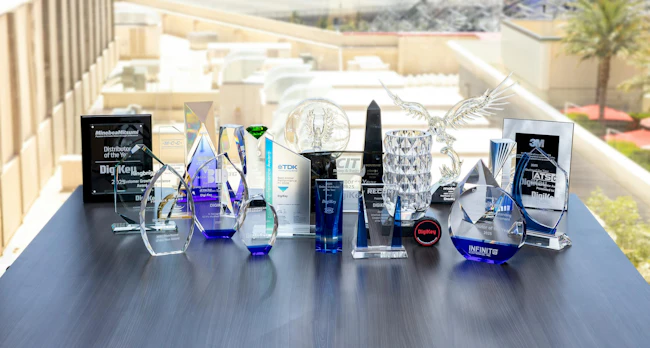 DigiKey's awards from its 2026 EDS Leadership Summit displayed on a wooden table