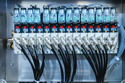 Pneumatic control board in production. Distributor of pneumatic control lines. Industrial photo Pneumatic control board in production. Distributor of pneumatic control lines. Industrial photo