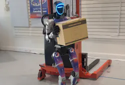 InOrbit.AI robot carrying a package in a factory facility InOrbit.AI robot carrying a package in a factory facility