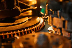 Copper bullets on production line part at weapon factory
