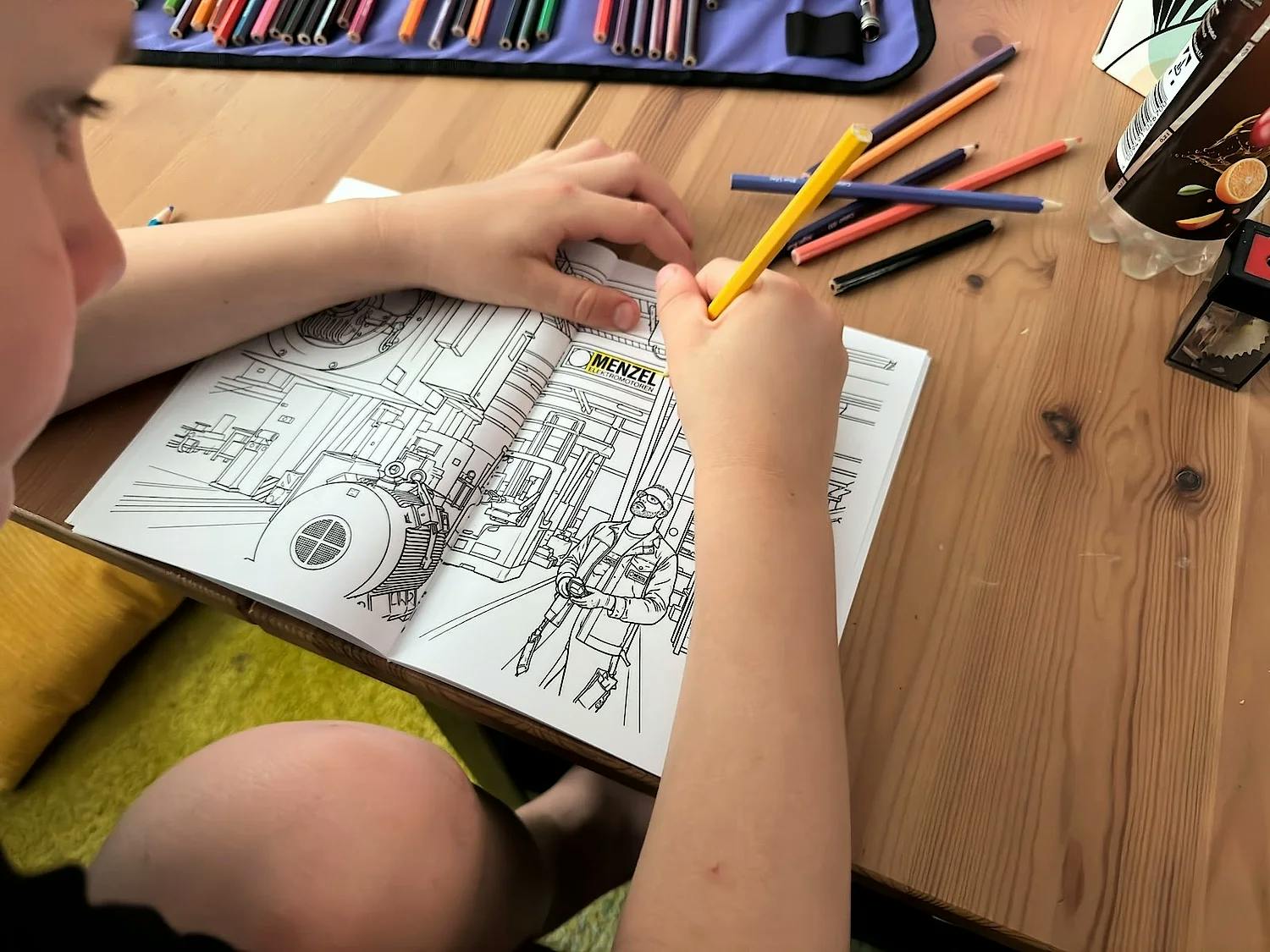 Based on photographs from Menzel's shop floor, the coloring book offers a vivid glimpse into the world of large electric motor manufacturing.