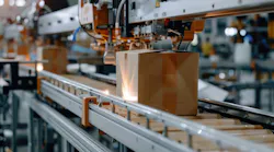 A cardboard box on a packaging conveyor belt in a Regal Rexnord factory