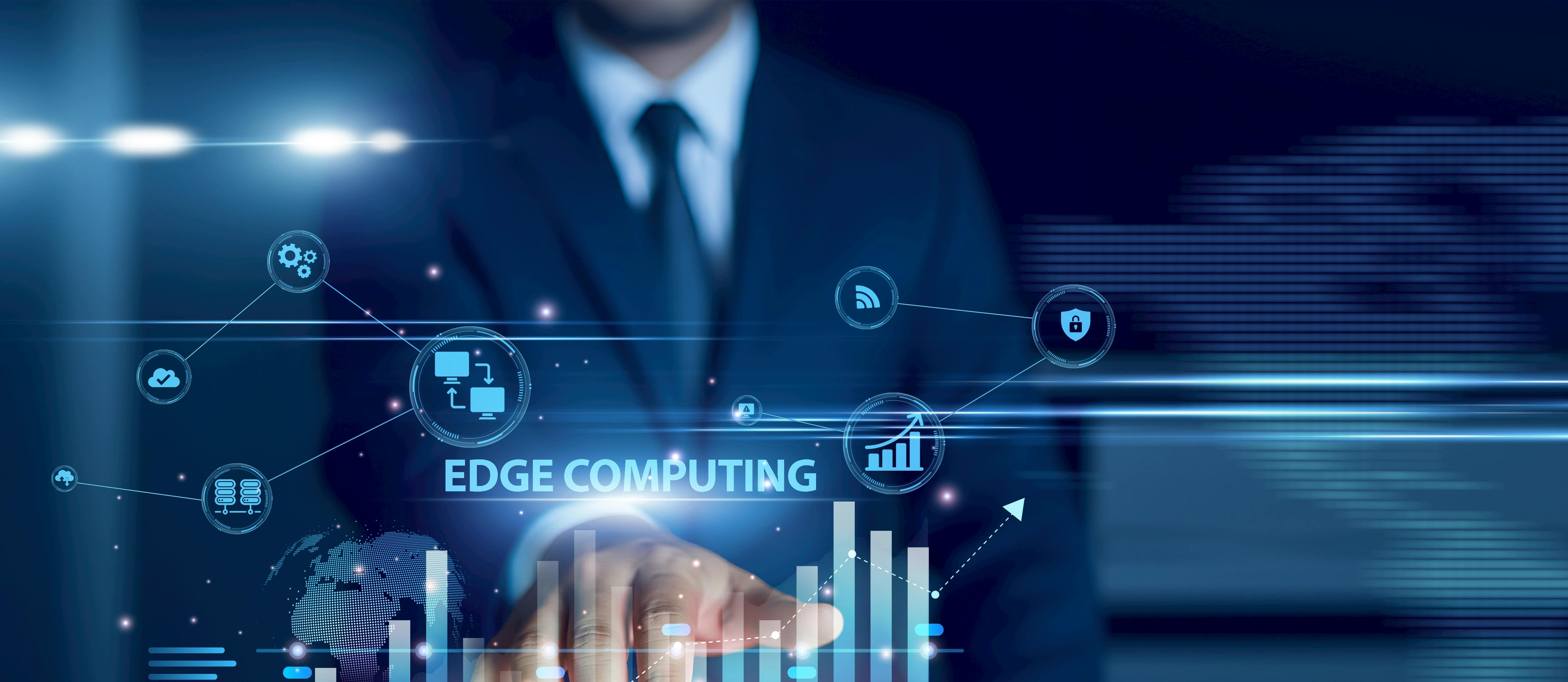 Businessman using tablet analyzing edge computing and growth graph chart, real-time processing, IoT data, cloud integration, decentralized network performance, digital transformation insights.