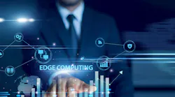 Businessman using tablet analyzing edge computing and growth graph chart, real-time processing, IoT data, cloud integration, decentralized network performance, digital transformation insights.