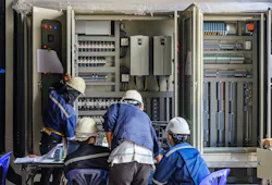 Engineer working on checking and maintenance equipment at wiring on PLC cabinet, Engineer checking status step up transformer