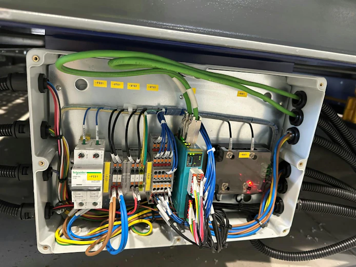 Front view of Dinkle I/O module with multi-colored wires.