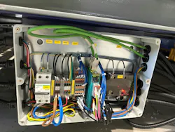 Front view of Dinkle I/O module with multi-colored wires.