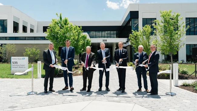 Endress+Hauser employees cutting the opening ribbon outside the new Greenwood facility.