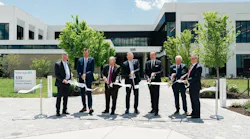 Endress+Hauser employees cutting the opening ribbon outside the new Greenwood facility.