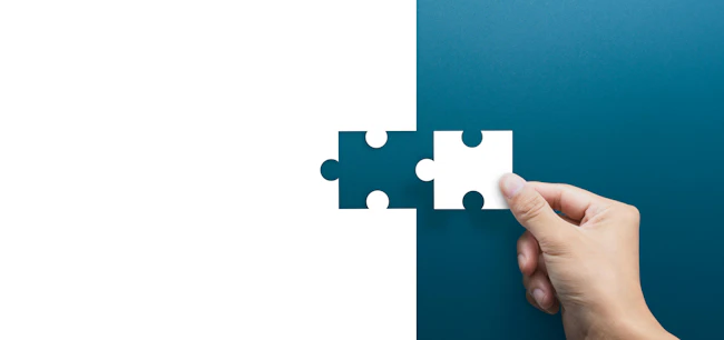 Joint venture, partnership, Mergers and acquisition concept, businessman hand connecting puzzle pieces