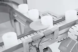 Figure 1: For small, fragile or difficult-to-convey products, the X45 puck handling system uses compact round pucks to create a stable and repeatable product interface.