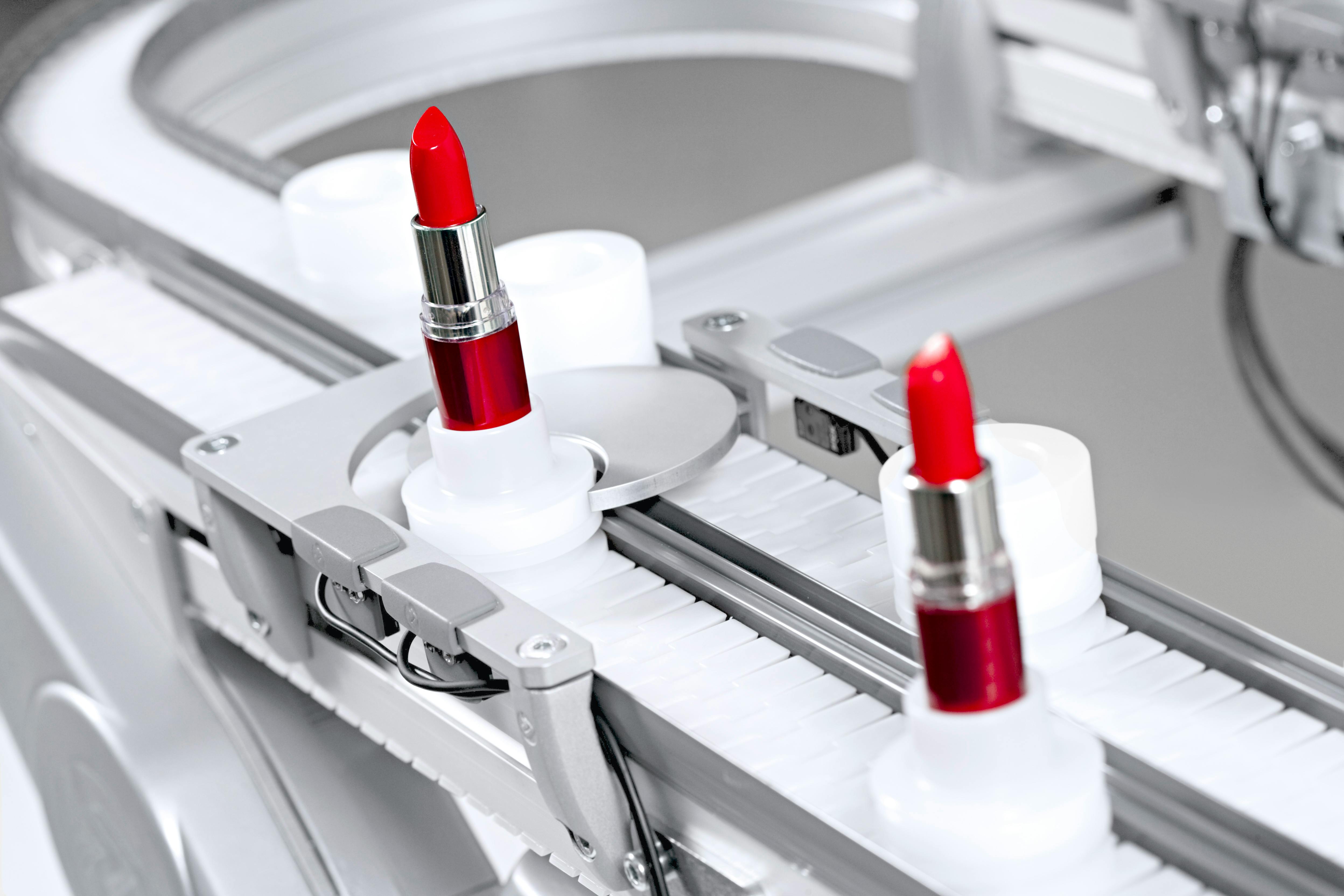 FlexLink X45 Conveyor System with two red lipsticks