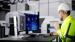 Engineer Doing 3D CAD Model Design On Computer At Factory