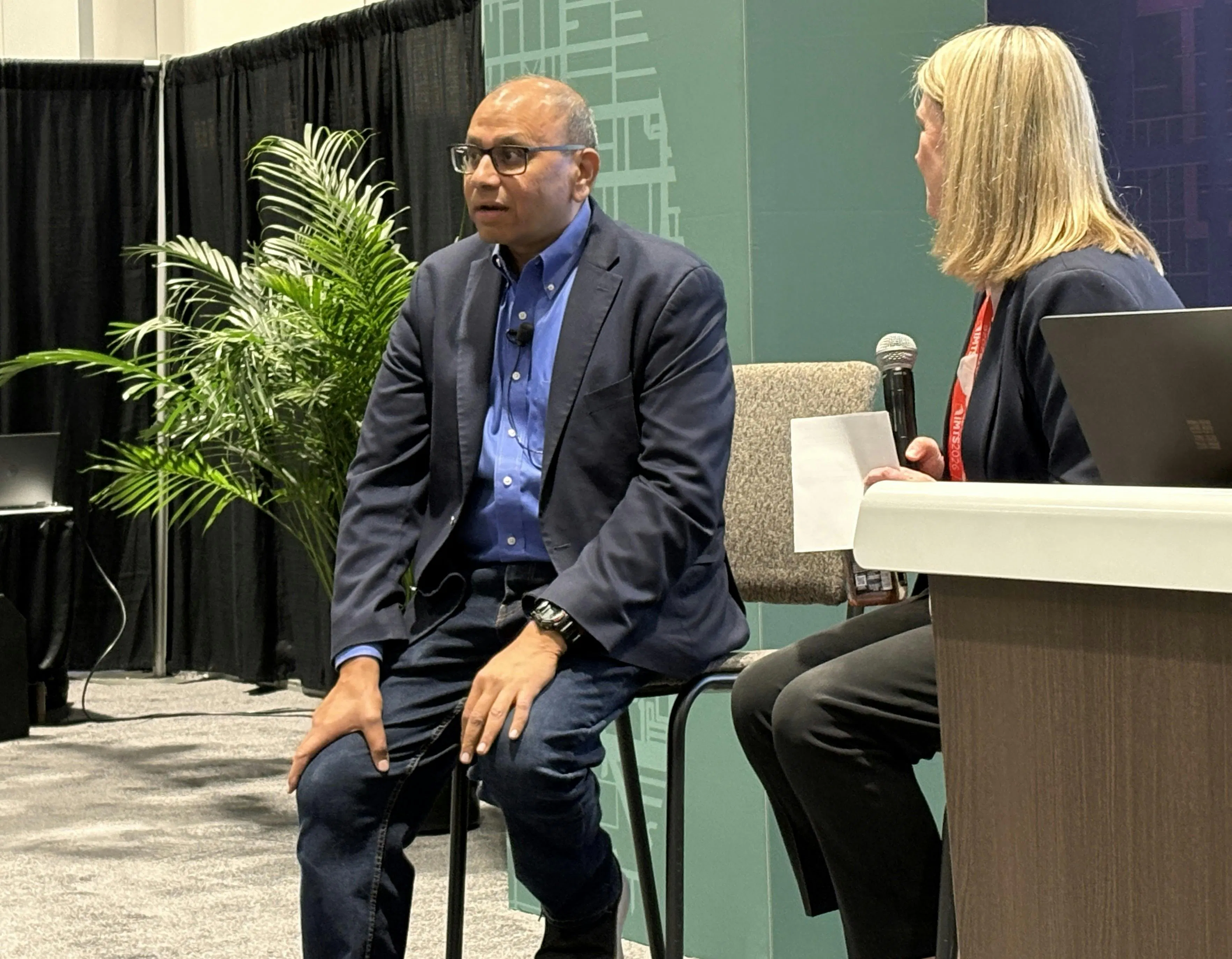 Figure 1: Rahul Garg (left), vice president of industrial machinery at Siemens, presented &ldquo;Smarter by Design: The Agentic Digital Thread&rdquo; at IMTS with Lindsay Berg, general manager, industry marketing, at Microsoft.