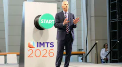 Doug Woods speaking in front of a podium at IMTS 2026