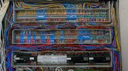 Shot of an intricate network of wires and connections within an electrical control panel