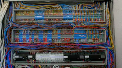 Shot of an intricate network of wires and connections within an electrical control panel