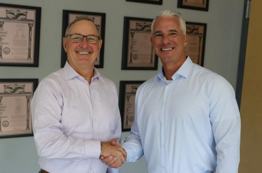 Craig Souser (left) has retired as president and CEO of JLS Automation and become chairman emeritus. Russ Stroner is the company&rsquo;s new president and CEO.